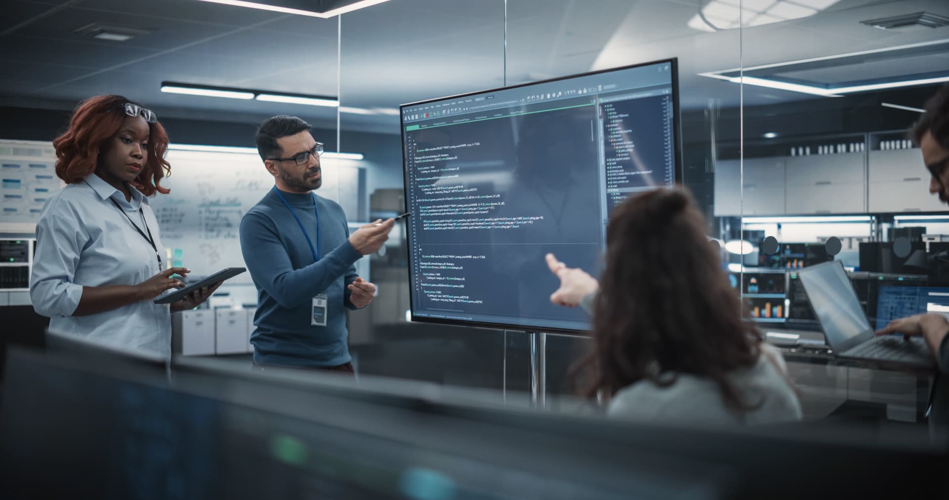 Software development team reviewing application architecture together